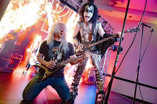 Kiss and man playing guitar